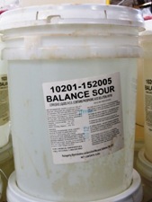opaque bucket, white lid, clear liquid, label - Balance Sour